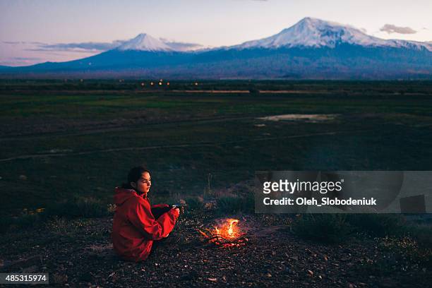 girl near the fireplace - beautiful armenian women stock pictures, royalty-free photos & images