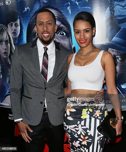 Actor Affion Crockett and guest attend the premiere of Open Road Films' "A Haunted House 2" at Regal Cinemas L.A. Live on April 16, 2014 in Los...