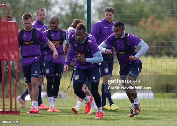 Yacouba Sylla of Aston Villa in action with team mate Leandro Bacuna during an Aston Villa training session at the club's training ground at Bodymoor...