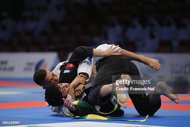 Jeremy Jackson of United States competes with Zaur Asukov of Russia in the Men's purple belt 70kg category during the Abu Dhabi World Professional...