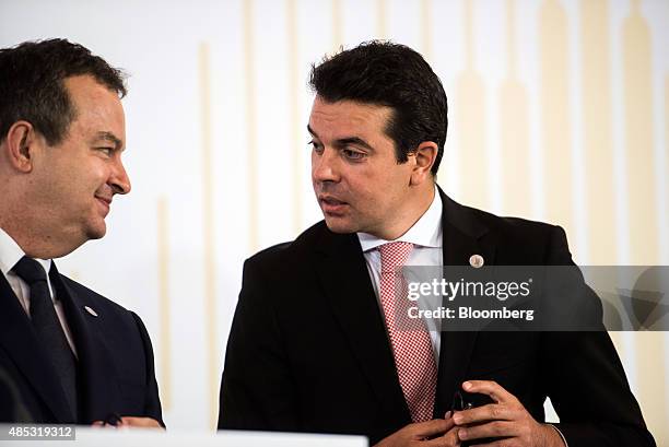 Ivica Dacic, Serbia's foreign minister, left and Nikola Poposki, Macedonia's foreign minister, speak during a news conference at the Western Balkans...