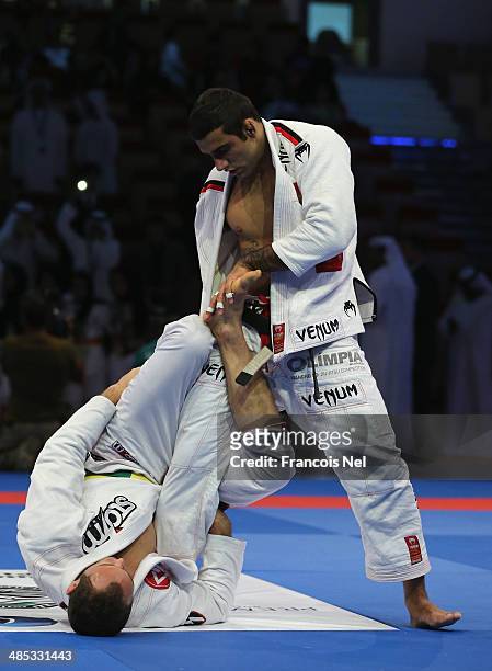 Victor Estima of Brazil competes with Leandro Lo of Brazil in the Men's black belt 82kg finals during the Abu Dhabi World Professional Jiu-Jitsu...