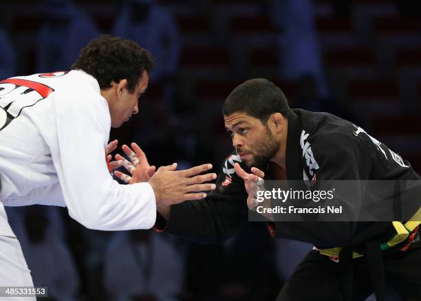 Andre Galvao of Brazil compete with Romulo Barral of Brazil in the Men's black belt 88 kg finals during the Abu Dhabi World Professional Jiu-Jitsu...