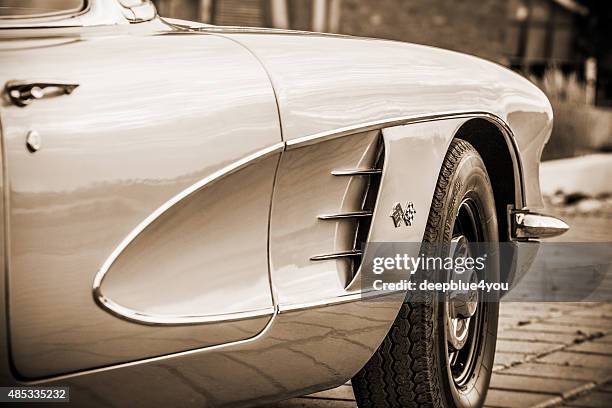 side view of parked chevrolet corvette convertible 1959 sepia toned - 1950 1959 stock pictures, royalty-free photos & images