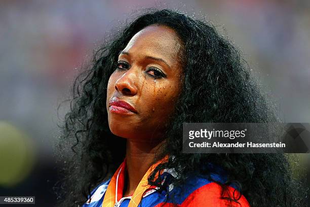 Gold medalist Yarisley Silva of Cuba shows her emotion on the podium during the medal ceremony for the Women's Pole Vault final during day six of the...