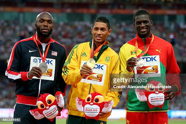 Silver medalist Lashawn Merritt of the United States, gold medalist Wayde Van Niekerk of South Africa and bronze medalist Kirani James of Grenada...