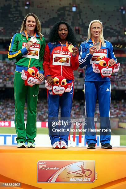 Silver medalist Fabiana Murer of Brazil, gold medalist Yarisley Silva of Cuba and bronze medalist Nikoleta Kyriakopoulou of Greece pose on the podium...