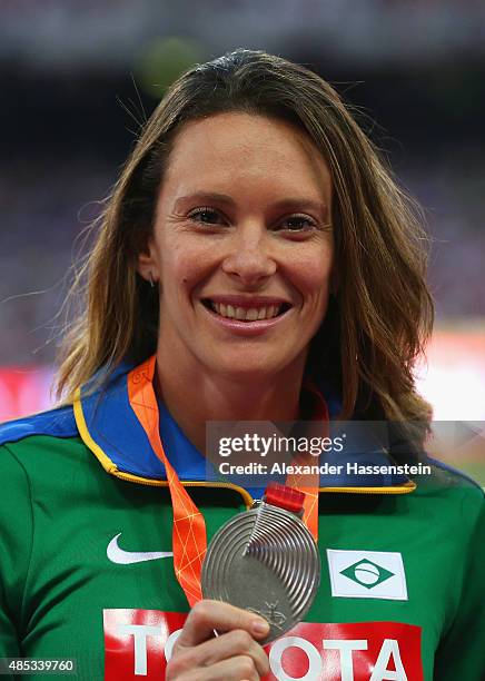 Silver medalist Fabiana Murer of Brazil poses on the podium during the medal ceremony for the Women's Pole Vault final uring day six of the 15th IAAF...