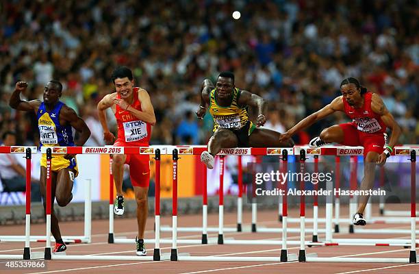 Greggmar Swift of Barbados, Wenjun Xie of China, Omar McLeod of Jamaica and Aries Merritt of the United States compete in the Men's 110 metres...