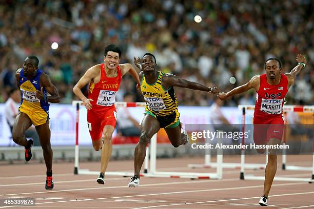 Greggmar Swift of Barbados, Wenjun Xie of China, Omar McLeod of Jamaica and Aries Merritt of the United States compete in the Men's 110 metres...