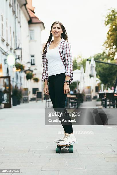 skateboarder in the city - woman longboard stock pictures, royalty-free photos & images