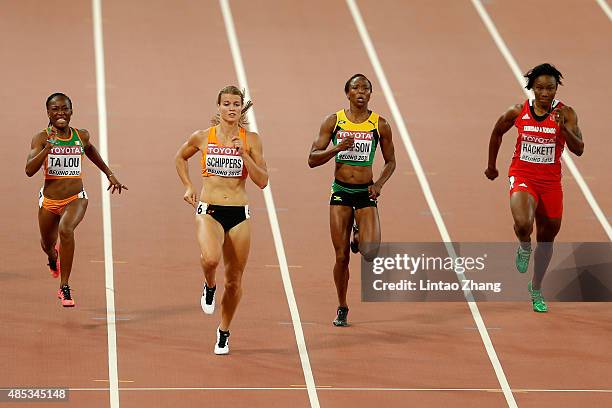 Marie-Josee Ta Lou of Cote d'Ivoire, Dafne Schippers of the Netherlands, Sherone Simpson of Jamaica and Semoy Hackett of Trinidad and Tobago compete...