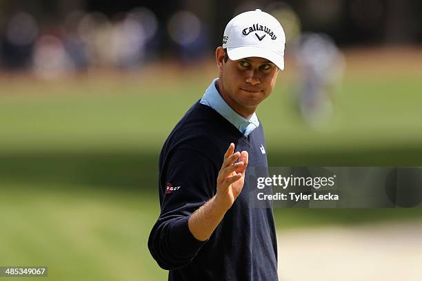 Harris English acknowledges the gallery on the 9th green during the first round of the RBC Heritage at Harbour Town Golf Links on April 17, 2014 in...