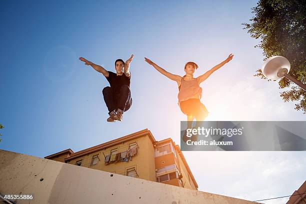 practicing parkour in the city - free running stock pictures, royalty-free photos & images