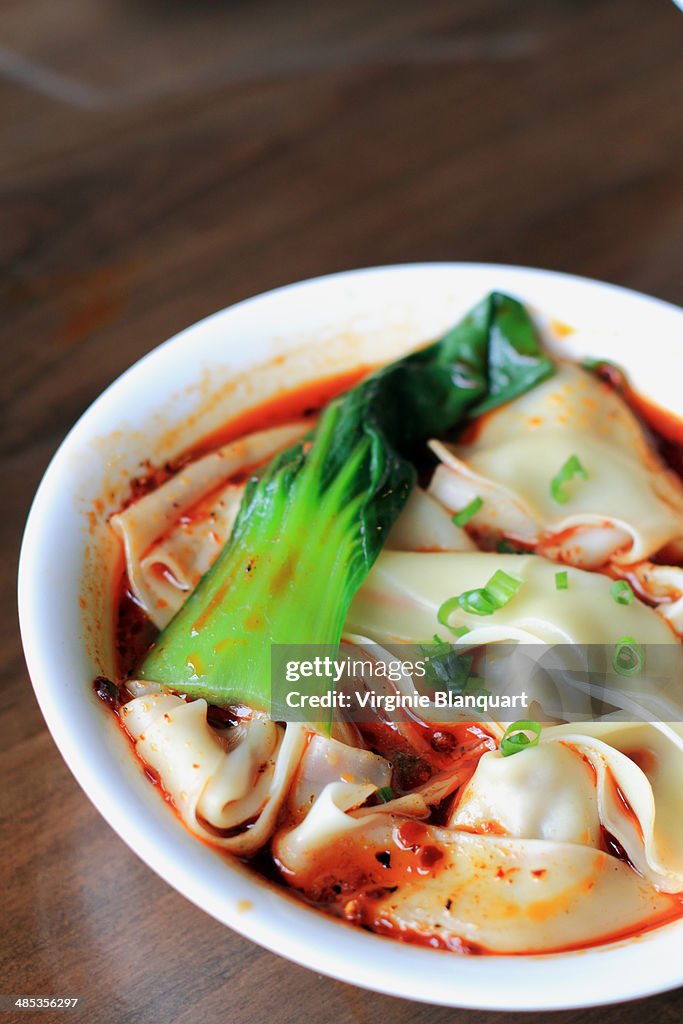 Szechuan dumplings in hot and spicy soup