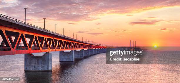 oresundsbron bridge at sunset - malmö stock pictures, royalty-free photos & images