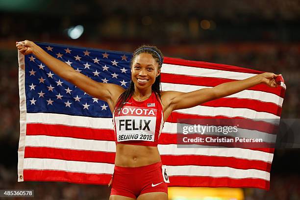 Allyson Felix of the United States celebrates after winning gold in the Women's 400 metres Final during day six of the 15th IAAF World Athletics...