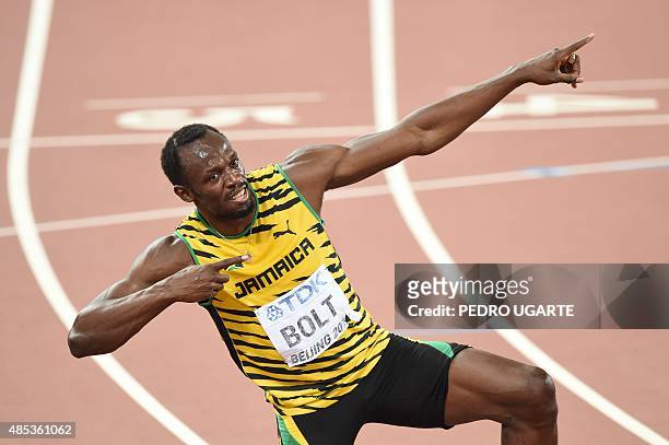 Jamaica's Usain Bolt makes his trademark celebration pose after winning the final of the men's 200 metres athletics event at the 2015 IAAF World...