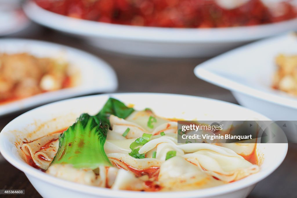 Bowl of szechuan dumplings soup