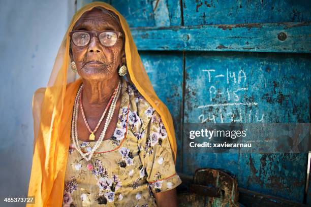 indian senior woman - stern gold stock pictures, royalty-free photos & images