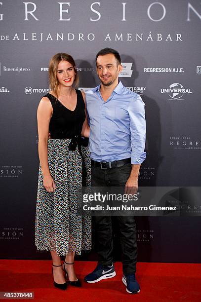 Actress Emma Watson and director Alejandro Amenabar attend the 'Regression' photocall at Villamagna Hotel on August 27, 2015 in Madrid, Spain.