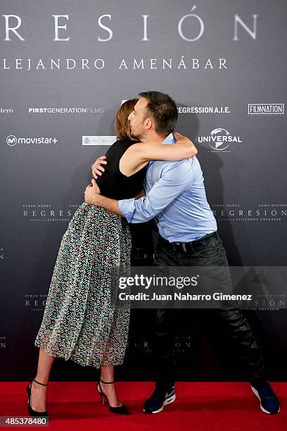 Actress Emma Watson and director Alejandro Amenabar attend the 'Regression' photocall at Villamagna Hotel on August 27, 2015 in Madrid, Spain.