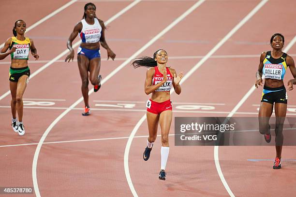 Allyson Felix of the United States crosses the finish line to win gold in the Women's 400 metres Final during day six of the 15th IAAF World...