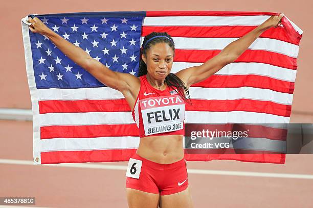 Allyson Felix of the United States celebrates after winning gold in the Women's 400 metres Final during day six of the 15th IAAF World Athletics...