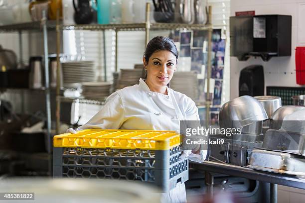 woman working in commercial kitchen - restaurant cleaning stock pictures, royalty-free photos & images