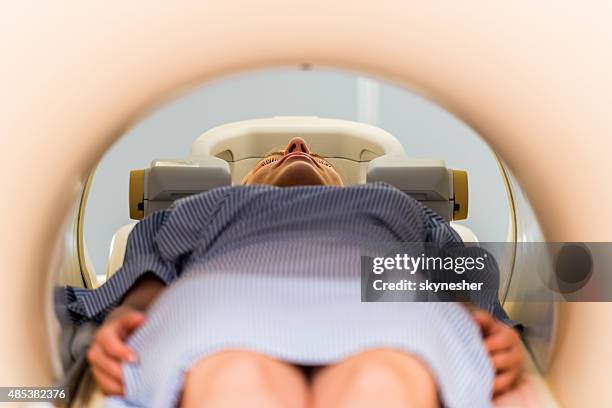 close-up of a patient receiving an mri scan. - radiotherapy stock pictures, royalty-free photos & images