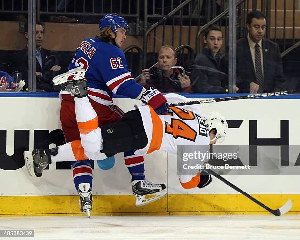 Matt Read of the Philadelphia Flyers bounces off Carl Hagelin of the New York Rangers during the first period in Game One of the First Round of the...