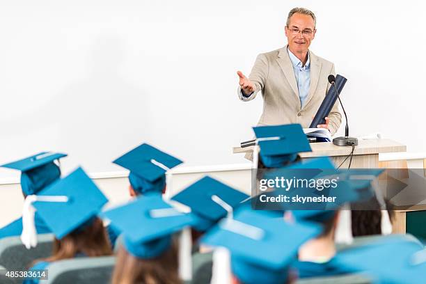 professor gives a speech during graduation ceremony. - graduation speech stock pictures, royalty-free photos & images