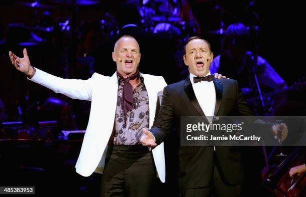 Sting and Kevin Spacey perform during the 25th Anniversary Rainforest Fund Benefit Concert at Carnegie Hall on April 17, 2014 in New York City.