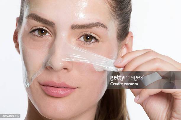 peeling off facial mask - peeling off bildbanksfoton och bilder