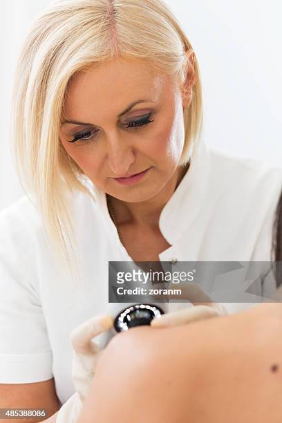 dermatologist checking patient skin - skin cancer face 個照片及圖片檔