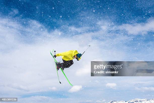 man ski jumping in air - freestyle skiing stock pictures, royalty-free photos & images