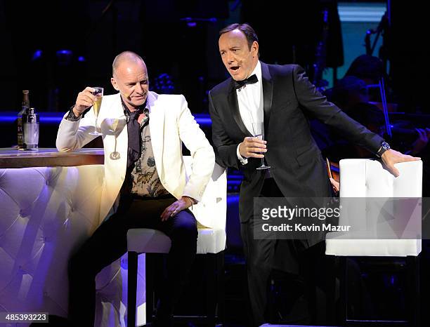 Kevin Spacey and Sting perform onstage during The 2014 Revlon Concert For The Rainforest Fund at Carnegie Hall on April 17, 2014 in New York City.
