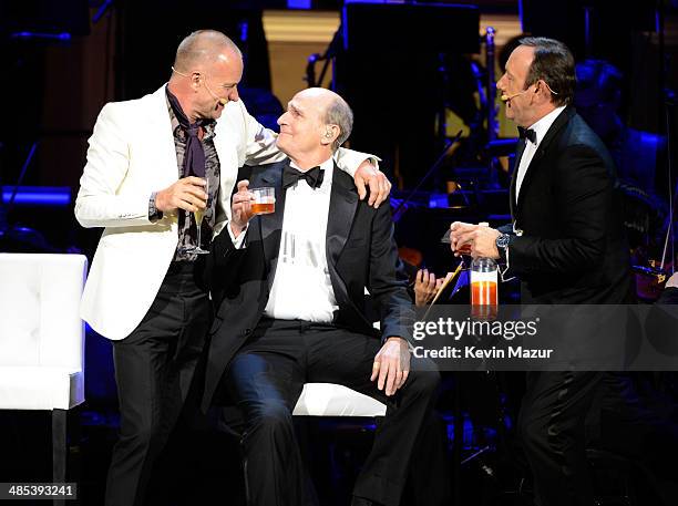 Kevin Spacey, Sting and James Taylor perform onstage during The 2014 Revlon Concert For The Rainforest Fund at Carnegie Hall on April 17, 2014 in New...