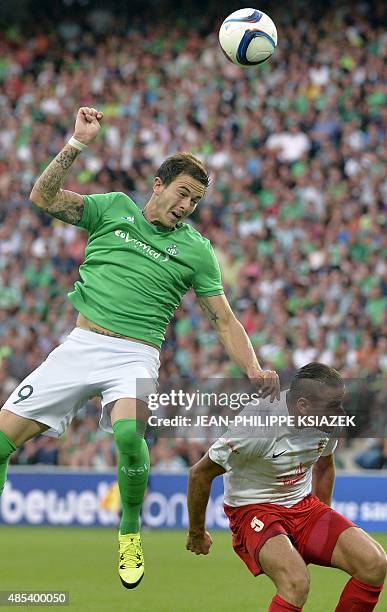 Saint-Etienne's French forward Nolan Roux vies for the ball with Milsami Orhei's Moldovan defender Petru Racu during the UEFA Europa League playoff...