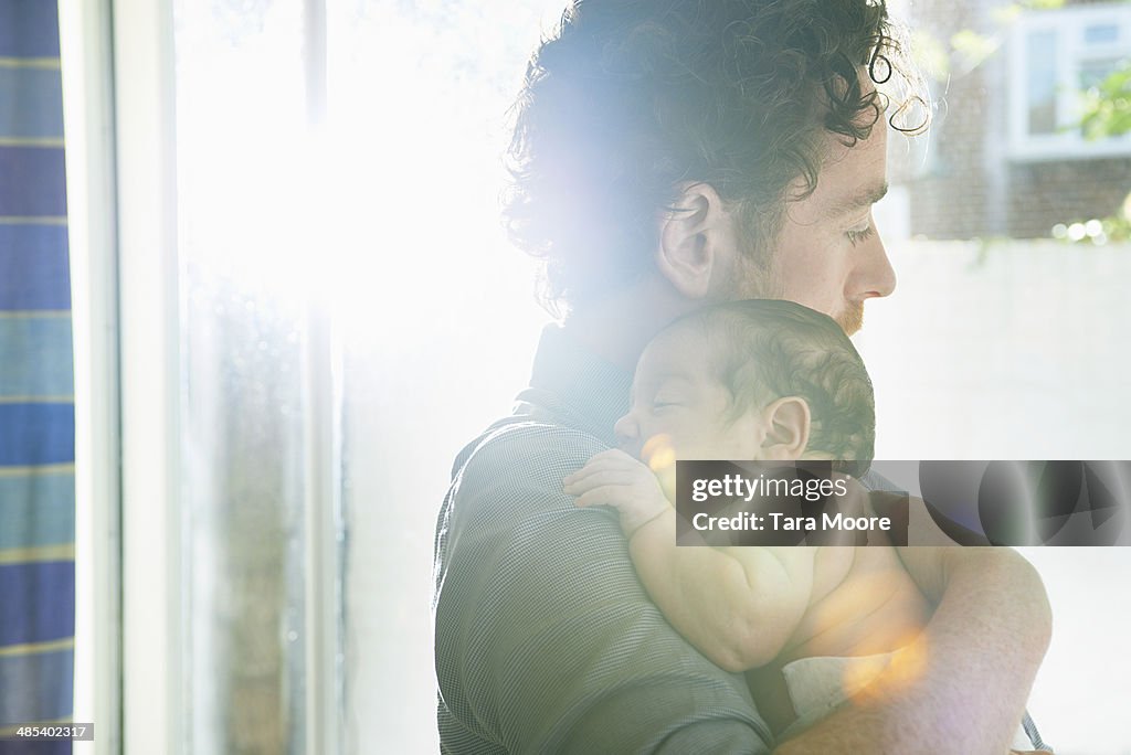 Father holding baby