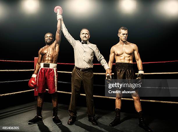 winner of the boxing fight - victory defeat stock pictures, royalty-free photos & images