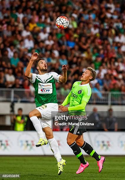 Filip Novak of FK Jablonec battles for the ball with Viktor Fischer of Ajax Amsterdam during the UEFA Europa League Play Off Round 2nd Leg match...