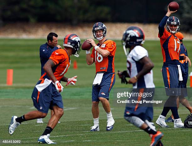 Quarterbacl Petyon Manning delivers a pass during a joint training session with the San Francisco 49ers and the Denver Broncos at the Denver Broncos...