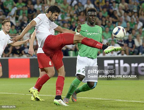 Milsami Orhei's Moroccan defender Adil Rhaili kicks the ball next to Saint-Etienne's Senegalese defender Moustapha Bayal Sall during the UEFA Europa...