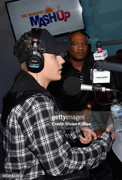 Justin Bieber and radio personality Stanley T. At SiriusXM Hits 1's The Morning Mash Up at SiriusXM Studios on August 27, 2015 in Los Angeles,...