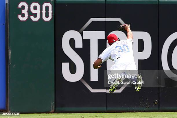 Will Venable of the Texas Rangers makes a diving catch in the second inning during a game against the Toronto Blue Jays at Globe Life Park in...