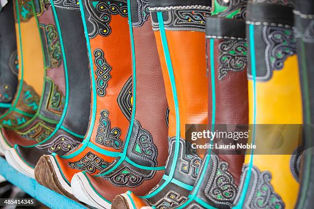 mongolian boots on sale at the black market - boot sale stock pictures, royalty-free photos & images