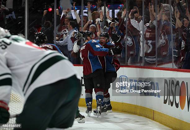 Paul Stastny of the Colorado Avalanche celebrates his game winning goal in overtime against the Minnesota Wild with Tyson Barrie of the Colorado...