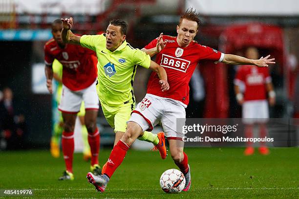 Adrien Trebel of Standard Liege tackles Mattias Mostrom of Molde FK during the UEFA Europa League play off round second leg match between Standard...