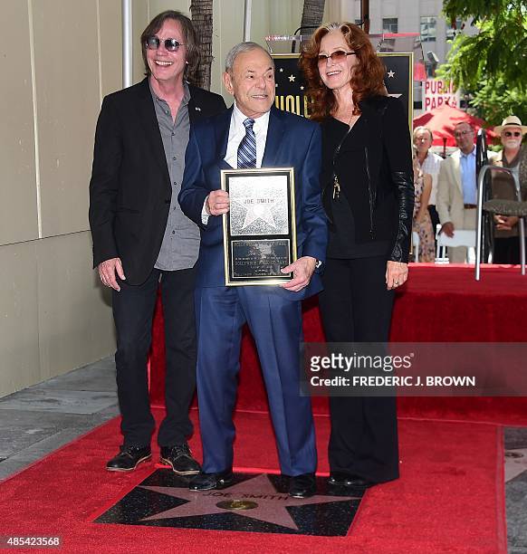 Music executive Joe Smith poses with musicians Jackson Brown and Bonnie Raitt during his Hollywood Walk of Fame Star ceremony in Hollywood,...